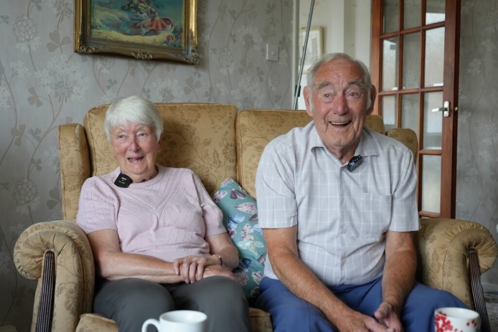 Old couple smiling together.